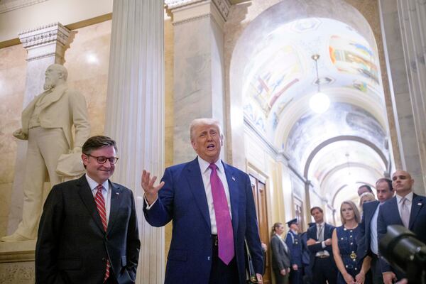 President Donald Trump, right, is joined by Speaker of the House Mike Johnson, R-La., as he arrives for a meeting with the House Republican Conference at the Capitol, Tuesday, May 20, 2025, in Washington. (AP Photo/Rod Lamkey, Jr.)