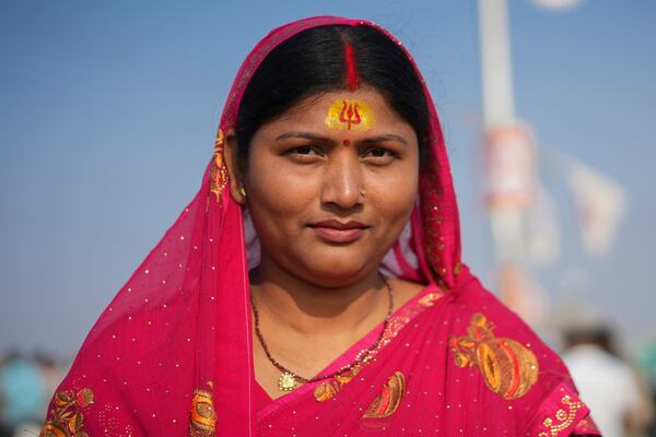 A Hindu devotee wears a sacred mark on her forehead at the confluence of the Ganges, the Yamuna, and the Saraswati rivers during the 45-day-long Maha Kumbh festival in Prayagraj, India, Tuesday, Jan. 28, 2025. (AP Photo/Deepak Sharma)