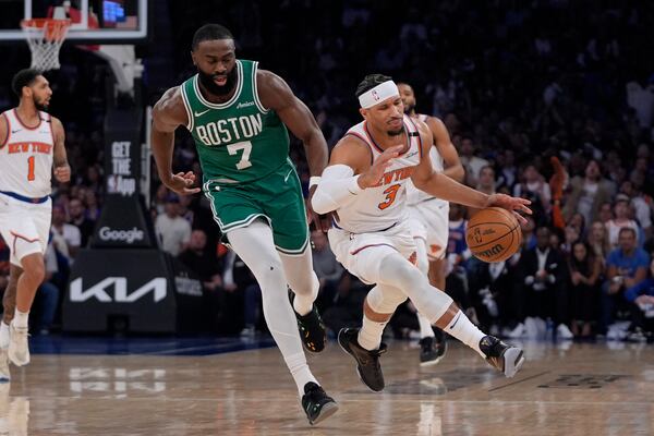 Boston Celtics' Jaylen Brown, left, knocks over New York Knicks' Josh Hart, right, during the first half of Game 3 of an NBA basketball second-round playoff series, Saturday, May 10, 2025, in New York. (AP Photo/Pamela Smith)