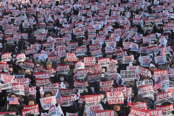 FILE- Supporters of impeached South Korean President Yoon Suk Yeol stage a rally to oppose his impeachment in Seoul, South Korea, Saturday, Jan. 11, 2025. The letters read, "Impeachment is invalid." (AP Photo/Ahn Young-joon, File)