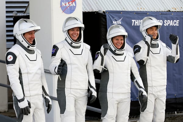 Crew10 members, from left, cosmonaut Kirill Peskov, astronaut Nichole Ayers, astronaut Anne McClain and JAXA astronaut Takuya Onishi leave the Operations and Checkout building before heading to Launch Pad 39-A at the Kennedy Space Center in Cape Canaveral, Fla., for a mission to the International Space Station in Cape Canaveral, Fla., Friday, March 14, 2025. (AP Photo/Terry Renna)