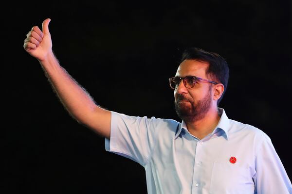 Singapore opposition leader and Workers' Party (WP) Secretary-General, Pritam Singh greets supporters at the assembly centre during the general election in Singapore, Saturday, May 3, 2025. (AP Photo/Suhaimi Abdullah)