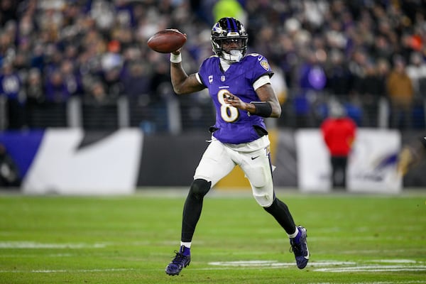 Baltimore Ravens quarterback Lamar Jackson looks to pass against the Pittsburgh Steelers during the first half of an NFL wild-card playoff football game, Saturday, Jan. 11, 2025, in Baltimore. (AP Photo/Nick Wass)