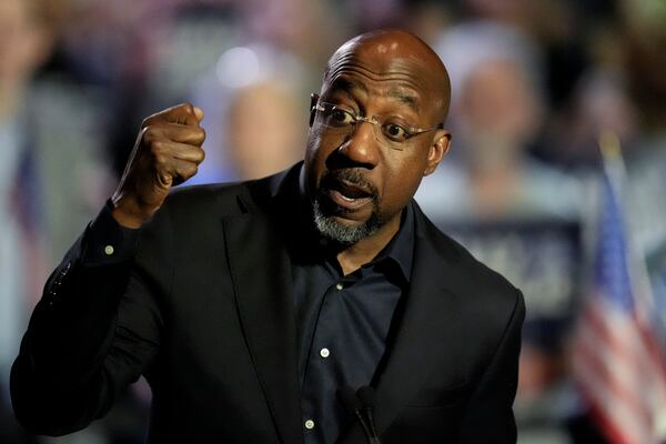 U.S. Sen. Raphael Warnock, D-Ga., speaks during a Rally for our Republic gathering, Saturday, March 22, 2025, in Atlanta. (AP Photo/Mike Stewart)