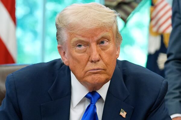 President Donald Trump speaks with reporters as he signs executive orders and proclamations in the Oval Office of the White House, Monday, May 5, 2025, in Washington. (AP Photo/Alex Brandon)