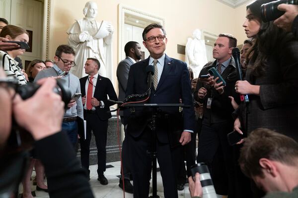 Speaker of the House Mike Johnson, R-La., talks to reporters after the House approved a funding bill to avert the government shutdown, at the Capitol in Washington, Friday, Dec. 20, 2024. (AP Photo/Jose Luis Magana)