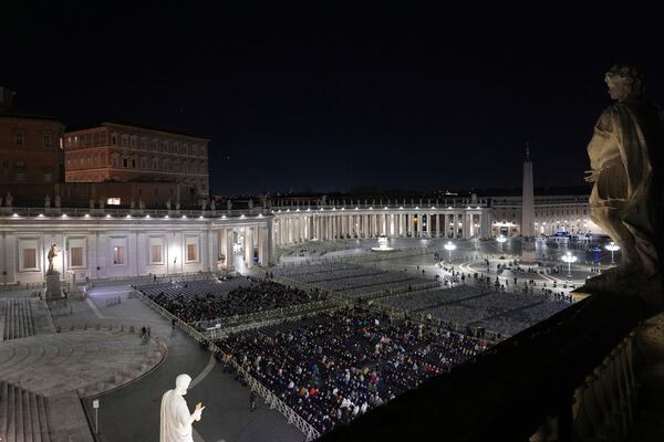 People attend as The Pope's vicar for the dioceses of Rome Cardinal Baldassarre Reina holds a rosary prayer for the health of Pope Francis in St Peter's Square at The Vatican, Thursday, Feb. 27, 2025. (AP Photo/Kirsty Wigglesworth)