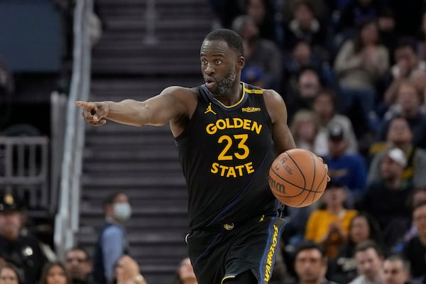 Golden State Warriors forward Draymond Green (23) gestures toward teammates during the second half of an NBA basketball game against the Orlando Magic in San Francisco, Monday, Feb. 3, 2025. (AP Photo/Jeff Chiu)