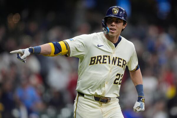 Milwaukee Brewers' Christian Yelich gestures after hitting a walk off grand slam during the 10th inning of a baseball game against the Boston Red Sox, Tuesday, May 27, 2025, in Milwaukee. (AP Photo/Aaron Gash)