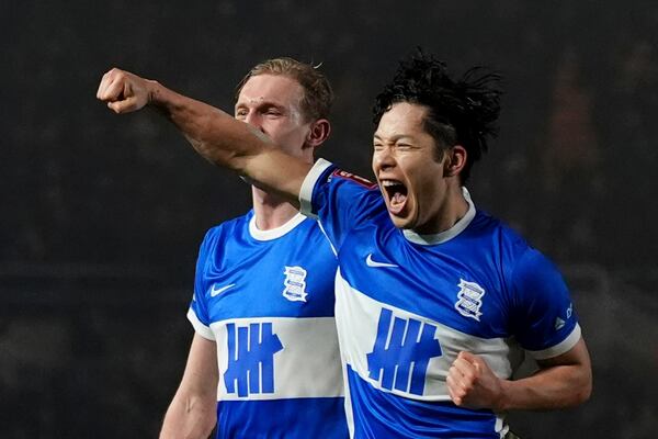 Birmingham City's Tomoki Iwata, right, celebrates scoring during the English FA Cup fourth round soccer match between Birmingham City and Newcastle United at in Birmingham, England, Saturday Feb. 8, 2025. (Bradley Collyer/PA via AP)