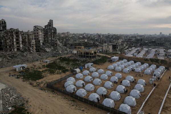 A tent camp for displaced Palestinians is set up amid destroyed buildings in the west of Al-Shati camp, west of Gaza City, on Monday, March 3, 2025. (AP Photo/Jehad Alshrafi)