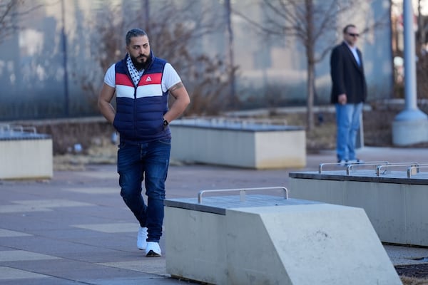 Odai Alfayoumi, father of six-year-old Palestinian boy Wadee Alfayoumi, enters Will County Courthouse where Joseph Czuba, 73, is charged with and on trial in the fatal stabbing of the boy and the wounding of his mother Hanan Shaheen, Tuesday, Feb. 25, 2025, in Joliet, Ill. (AP Photo/Erin Hooley)