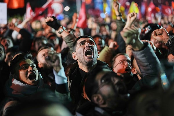 People gather outside the City Hall to protest the arrest of Istanbul Mayor Ekrem Imamoglu in Istanbul, Turkey, Wednesday, March 19, 2025. (AP Photo/Francisco Seco)