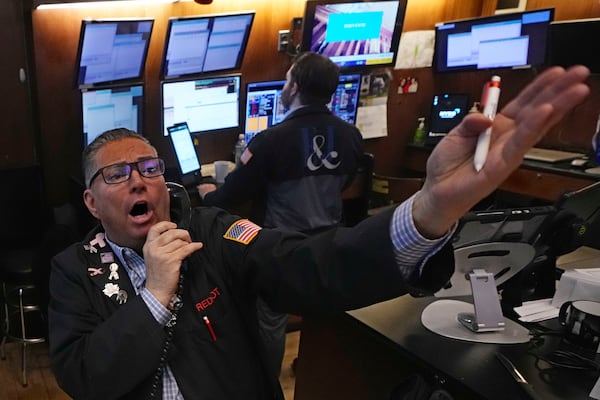 Trader Jonathan Mueller works on the floor of the New York Stock Exchange, Monday, Jan. 13, 2025. (AP Photo/Richard Drew)