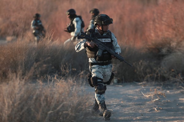 Mexican National Guard members patrol along the Mexico-US border in Ciudad Juarez, Wednesday, Feb. 5, 2025. (AP Photo/Christian Chavez)