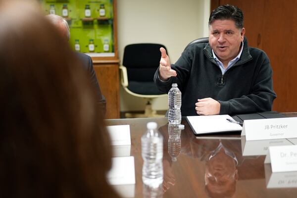 Illinois Gov. JB Pritzker talks during a visit to the Soybean Innovation Lab at University of Illinois, which is impacted by DOGE funding cuts, in Urbana, Ill., Wednesday, March 19, 2025. (AP Photo/Nam Y. Huh)