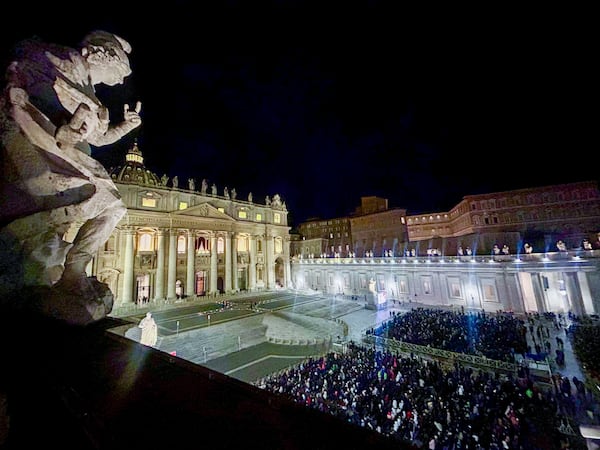 Faithful and pilgrims wait in St. Peter's Square for the opening of the holy door of St. Peter's Basilica at The Vatican, Tuesday, Dec. 24, 2024, marking the start of the Catholic jubiliar year 2025. (AP Photo/Gregorio Borgia)