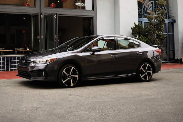 This photo provided by Subaru shows the 2022 Subaru Impreza, which is available used with all-wheel drive for less than $25,000. Its combination of all-wheel drive and priced-right utility makes it great for winter driving. (Courtesy of Subaru of America via AP)