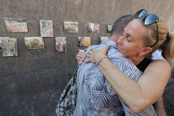 Relatives of a victim of a 2004 Indian Ocean tsunami hug each other during its 20th anniversary at Tsunami Memorial Park at Ban Nam Khem, Takuapa district of Phang Nga province, southern Thailand, Thursday, Dec. 26, 2024. (AP Photo/Wason Wanichakorn)