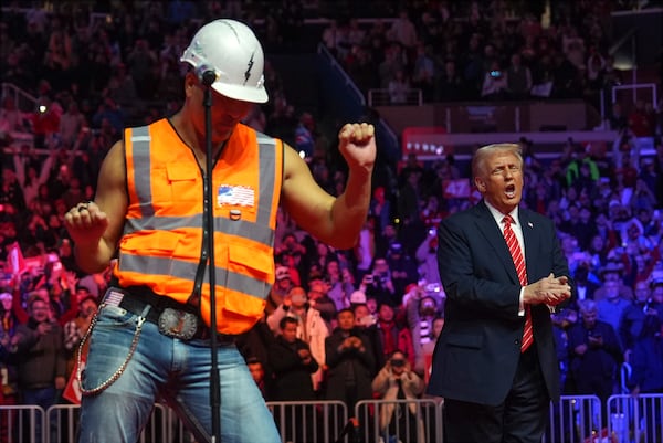 President-elect Donald Trump dances with The Village People at a rally ahead of the 60th Presidential Inauguration, Sunday, Jan. 19, 2025, in Washington. (AP Photo/Evan Vucci)