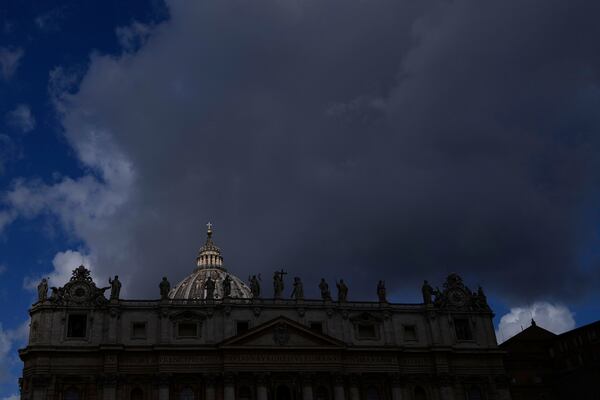 Clouds pass over the St. Peter's Basilica at the Vatican, Tuesday, May 6, 2025. (AP Photo/Gregorio Borgia)
