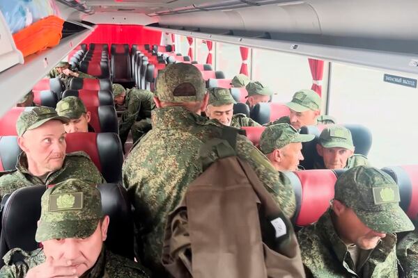 In this photo taken from a video released by Russian Defense Ministry press service, Russian servicemen ride a bus after returning from captivity after an exchange between Russia and Ukraine, at an undisclosed location in Belarus, Saturday, May 24, 2025. (Russian Defense Ministry Press Service via AP)