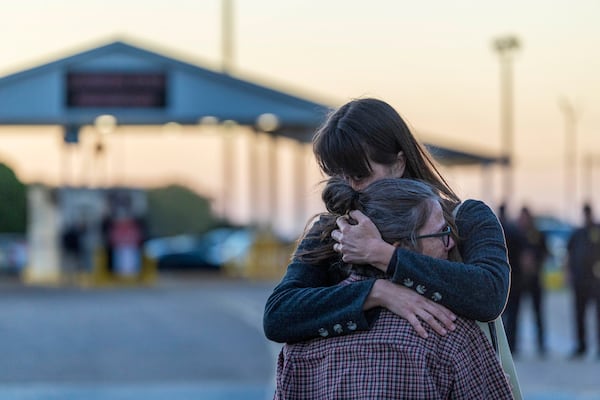 Faith leaders, activists, and supporters of Jessie Hoffman, Jr., hug outside the entrance to Louisiana State Penitentiary in Angola, la., moments after hearing that he was executed on Tuesday, March 18, 2025. (Chris Granger/The Times-Picayune/The New Orleans Advocate via AP)