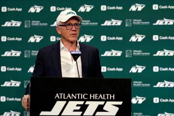 New York Jets owner Woody Johnson introduces new head coach Aaron Glenn and general manager Darren Mougey during a press conference at the NFL football team's training facility on Monday, Jan. 27, 2025, in Florham Park, N.J. (AP Photo/Adam Hunger)