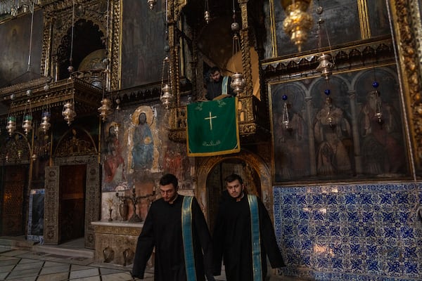 Armenian Christian clergy attend the daily afternoon prayer service at the St. James Cathedral at the Armenian quarter in Jerusalem, Thursday, Nov. 21, 2024. (AP Photo/Francisco Seco)