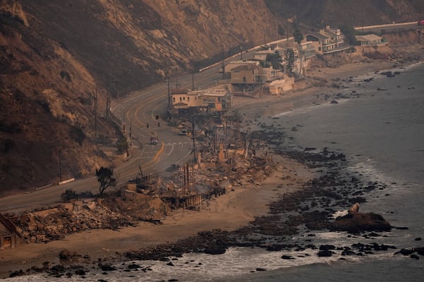 Beach front properties are left destroyed by the Palisades Fire, in this aerial view, Thursday, Jan. 9, 2025 in Malibu, Calif. (AP Photo/Mark J. Terrill)