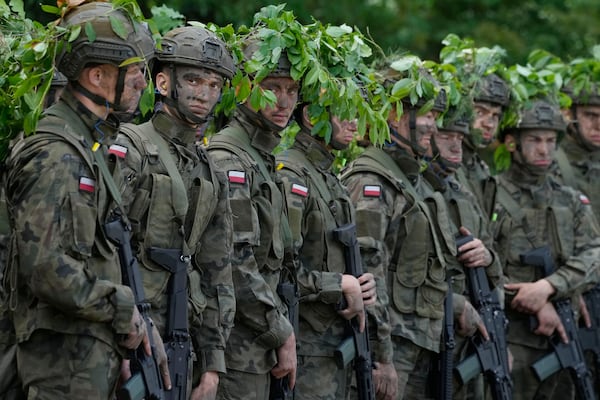 FILE - Volunteers takes part in basic training with the Polish army in Nowogrod, Poland, on June 20, 2024. (AP Photo/Czarek Sokolowski, File)