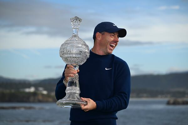 Rory McIlroy, of Northern Ireland, celebrates at Pebble Beach Golf Links after winning the AT&T Pebble Beach Pro-Am golf tournament, Sunday, Feb. 2, 2025, in Pebble Beach, Calif. (AP Photo/Nic Coury)