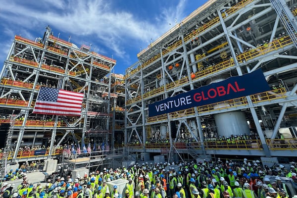 Venture Global workers await a rally with Secretary of Interior Doug Burgum and Secretary of Energy Chris Wright, Thursday, March 6, 2025, in Plaquemines Parish, La., where the company is investing billions of dollars in building out liquified natural gas export facilities. (AP Photo/Jack Brook)