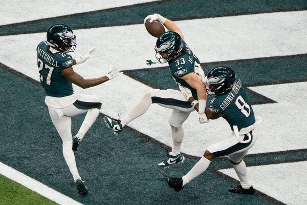 Philadelphia Eagles defensive back Cooper DeJean (33) celebrates after returning an interception for a touchdown against the Kansas City Chiefs during the first half of the NFL Super Bowl 59 football game, Sunday, Feb. 9, 2025, in New Orleans. (AP Photo/Charlie Riedel)