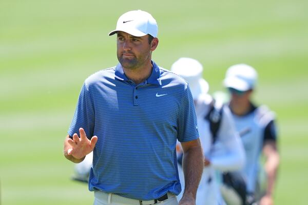 Scottie Scheffler waves after sinking a putt on the sixth green during the final round of the CJ Cup Byron Nelson golf tournament in McKinney, Texas, Sunday, May 4, 2025. (AP Photo/LM Otero)