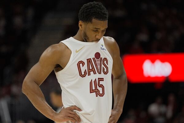 Cleveland Cavaliers guard Donovan Mitchell (45) chews on his jersey late in the second half during Game 1 in the Eastern Conference semifinals against the Indiana Pacers of the NBA basketball playoffs Sunday, May 4, 2025, in Cleveland. (AP Photo/Sue Ogrocki)