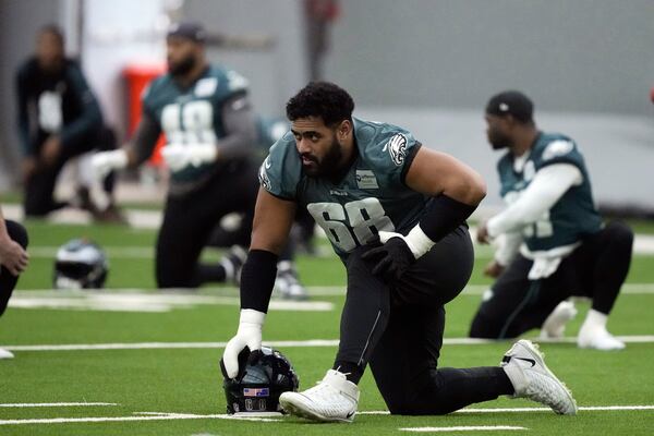 Philadelphia Eagles offensive tackle Jordan Mailata stretches during NFL football practice in Philadelphia, Friday, Jan. 31, 2025, ahead of Super Bowl 59 against the Kansas City Chiefs. (AP Photo/Matt Rourke)