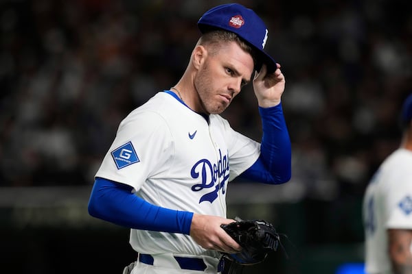 Los Angeles Dodgers first base Freddie Freeman stands by the base in the fourth inning of a spring training baseball game against the Yomiuri Giants in Tokyo, Japan, Saturday, March 15, 2025. (AP Photo/Eugene Hoshiko)