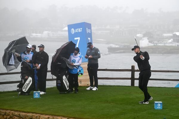 Cam Davis, of Australia, hits his tee shot on the seventh hole at Pebble Beach Golf Links during the third round of the AT&T Pebble Beach Pro-Am golf tournament, Saturday, Feb. 1, 2025, in Pebble Beach, Calif. (AP Photo/Nic Coury)