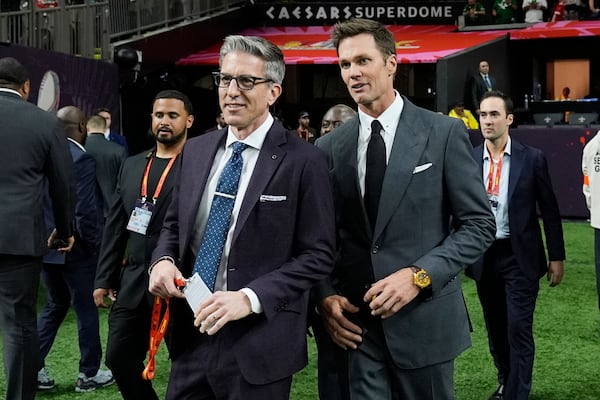 Tom Brady, right, arrives prior to the NFL Super Bowl 59 football game between the Kansas City Chiefs and the Philadelphia Eagles, Sunday, Feb. 9, 2025, in New Orleans. (AP Photo/Frank Franklin II)