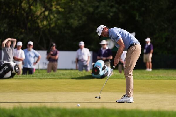 Keegan Bradley putts on the ninth green during the first round of the Truist Championship golf tournament at the Philadelphia Cricket Club, Thursday, May 8, 2025, in Flourtown, Pa. (AP Photo/Matt Rourke)