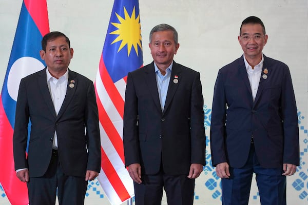 From left to right, Myanmar's Permanent Secretary to ASEAN Aung Kyaw Moe, Singapore's Minister of Foreign Affairs Vivian Balakrishnan and Thailand's Minister of Foreign Affairs Maris Sangiampongsa pose for a photo before a retreat session during the ASEAN Foreign Ministers' Retreat (AMM) in Langkawi Island, Malaysia, on Sunday, Jan. 19, 2025. AP Photo/Azneal Ishak, Pool)