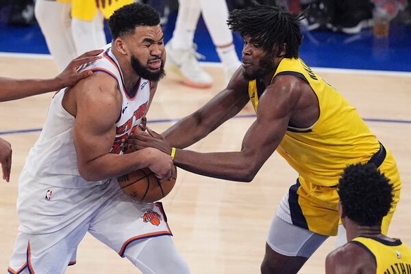 Indiana Pacers forward Jarace Walker (5) strips the ball from New York Knicks center Karl-Anthony Towns (32) during the fourth quarter of Game 5 of the NBA basketball Eastern Conference final, Thursday, May 29, 2025, in New York. (AP Photo/Frank Franklin II)