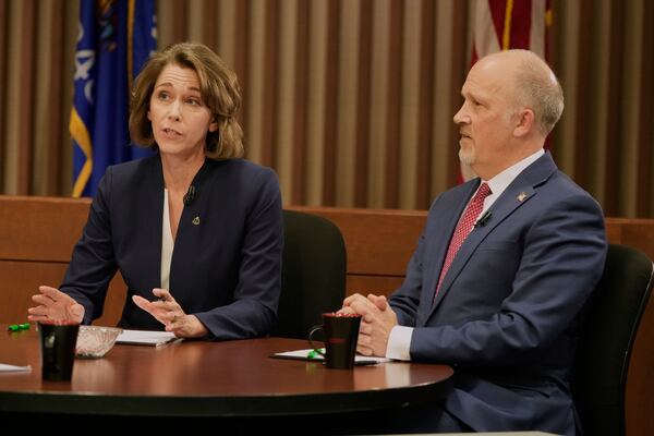 Wisconsin Supreme Court candidates Brad Schimel and Susan Crawford participate in a debate Wednesday, March 12, 2025, in Milwaukee. (AP Photo/Morry Gash)