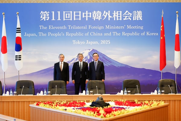 Chinese Foreign Minister Wang Yi, left, Japanese Foreign Minister Takeshi Iwaya, center, and South Korean Foreign Minister Cho Tae-yul pose for a photo during their trilateral foreign ministers' meeting in Tokyo Saturday, March 22, 2025.(Rodrigo Reyes Marin/Pool Photo via AP)