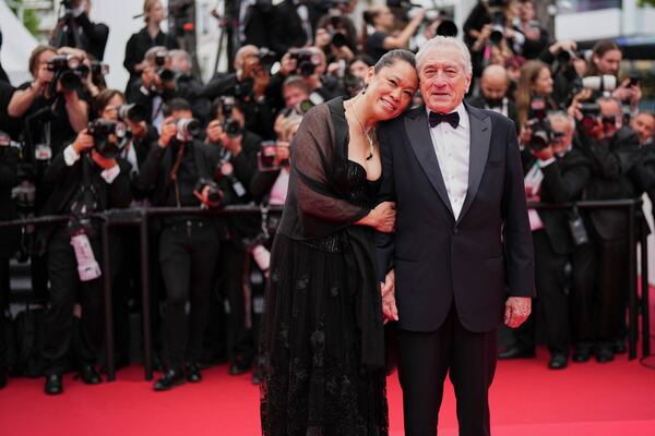 Tiffany Chen, left, and Robert De Niro pose for photographers during the opening ceremony red carpet of the 78th international film festival, Cannes, southern France, Tuesday, May 13, 2025. (Photo by Scott A Garfitt/Invision/AP)