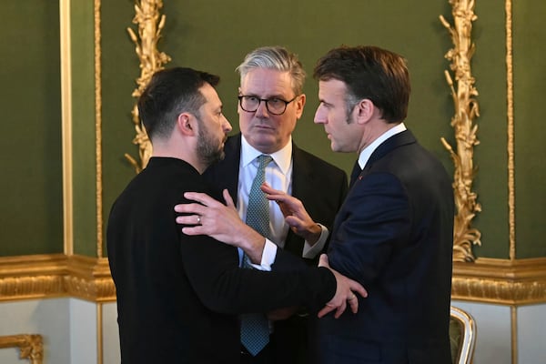 Britain's Prime Minister Keir Starmer, center, Ukraine's President Volodymyr Zelenskyy, left, and France's President Emmanuel Macron meet during the European leaders' summit to discuss Ukraine, hosted by Britain's Prime Minister Keir Starmer, at Lancaster House, London, Sunday March 2, 2025. (Justin Tallis/Pool via AP)