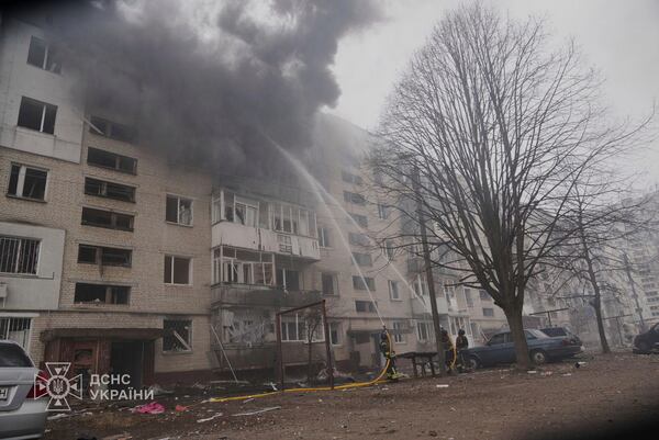 In this photo provided by the Ukrainian Emergency Service, firefighters put out the fire following a Russian attack in Sumy, Ukraine, Tuesday, March 25, 2025. (Ukrainian Emergency Service via AP)