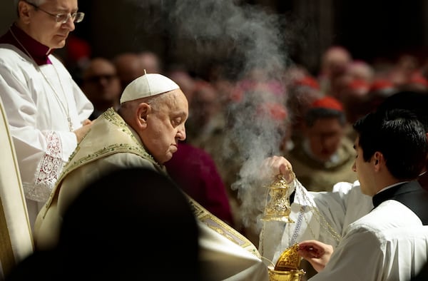 Pope Francis celebrates a Christmas Eve Mass on the day the Pope opens the Holy Door to mark the opening of the 2025 Catholic Holy Year, or Jubilee, in St. Peter's Basilica, at the Vatican, Dec. 24, 2024. (Remo Casilli/Pool Photo via AP)