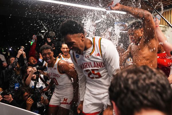 Maryland forward Julian Reese, left, celebrates with teammates, including center Derik Queen (25), who made the winning basket to beat Colorado State 72-71 in the second round of the NCAA college basketball tournament Sunday, March 23, 2025, in Seattle. (AP Photo/Lindsey Wasson)